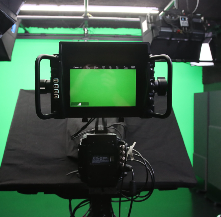 camera and studio view with green screen